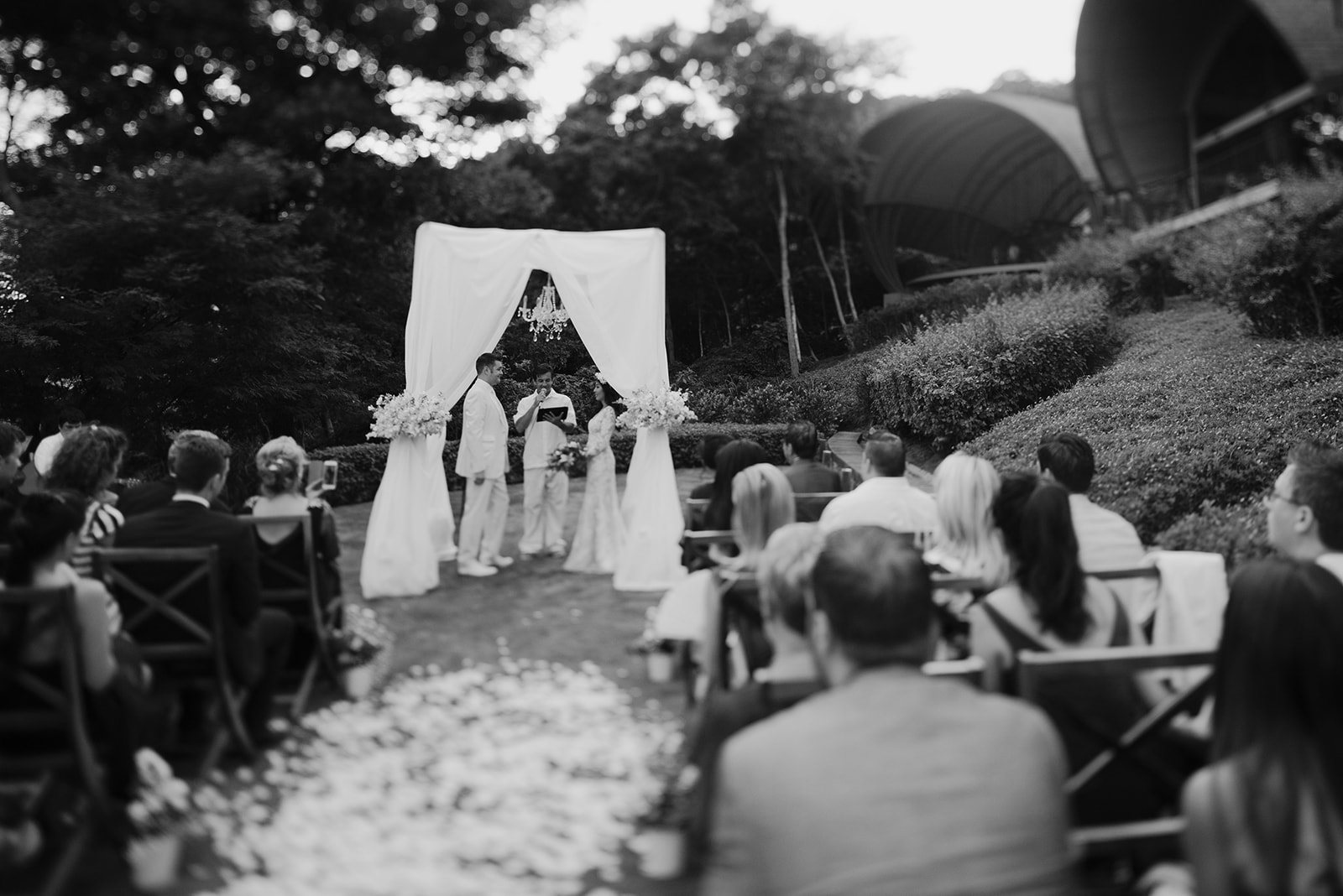 The same ceremony in black and white, from the aisle