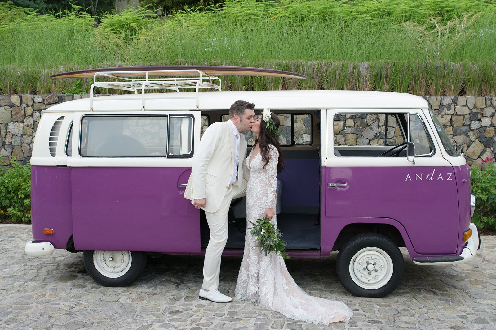 The couple in front of the purple VW van