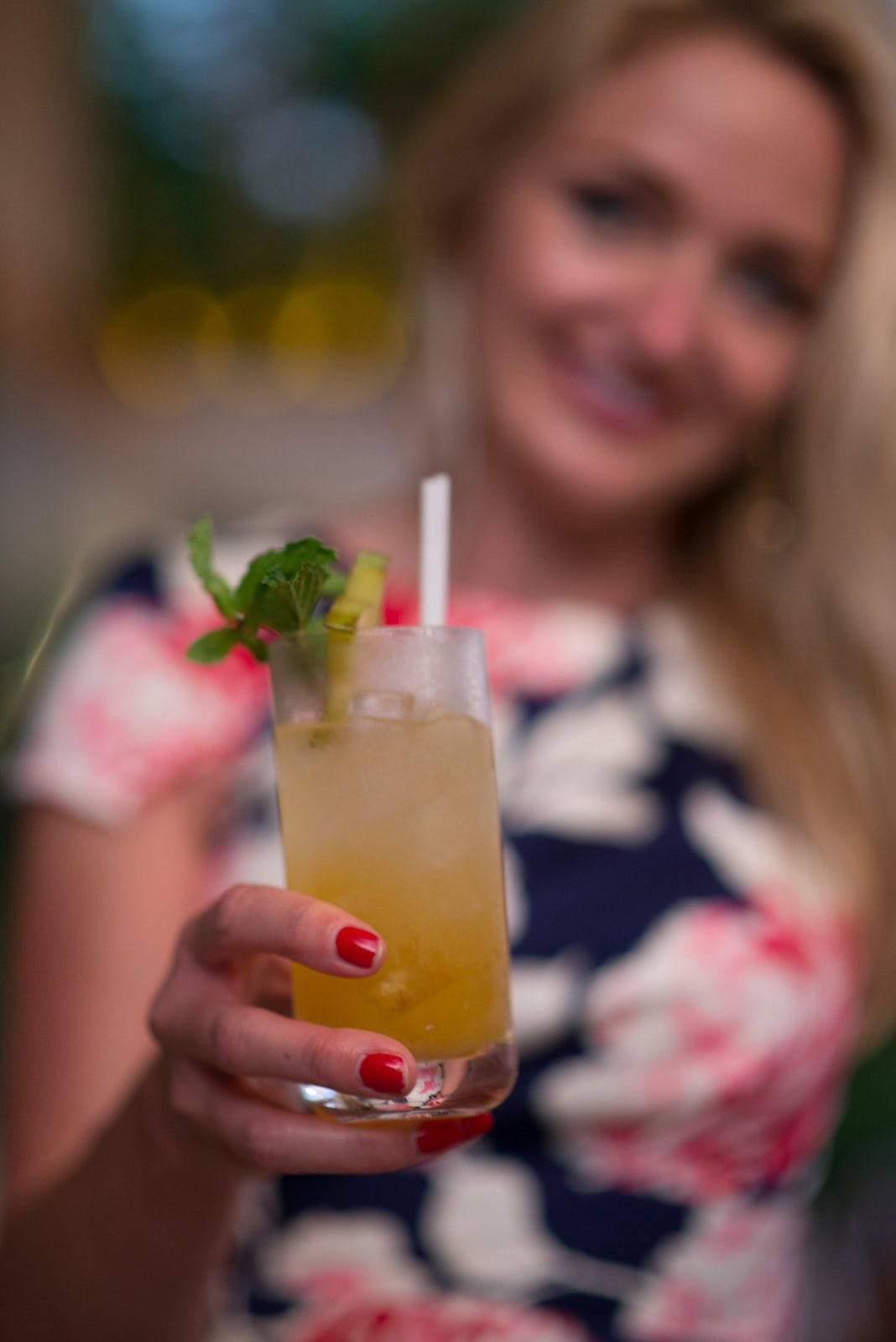 A guest holding up a cocktail