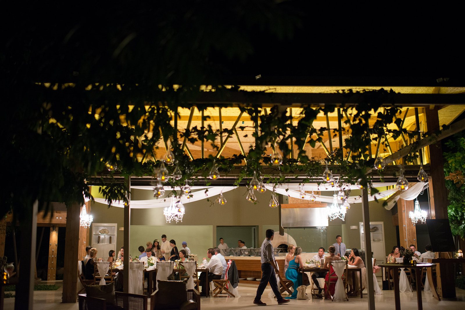 The reception glowing under the trees