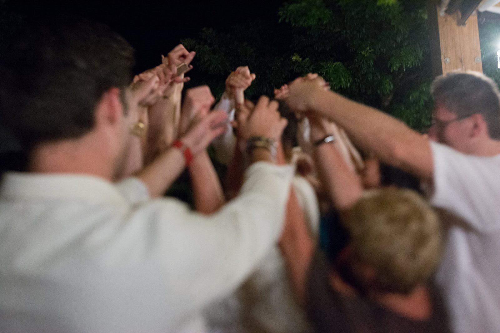 Guests lifting the groom on the dance floor