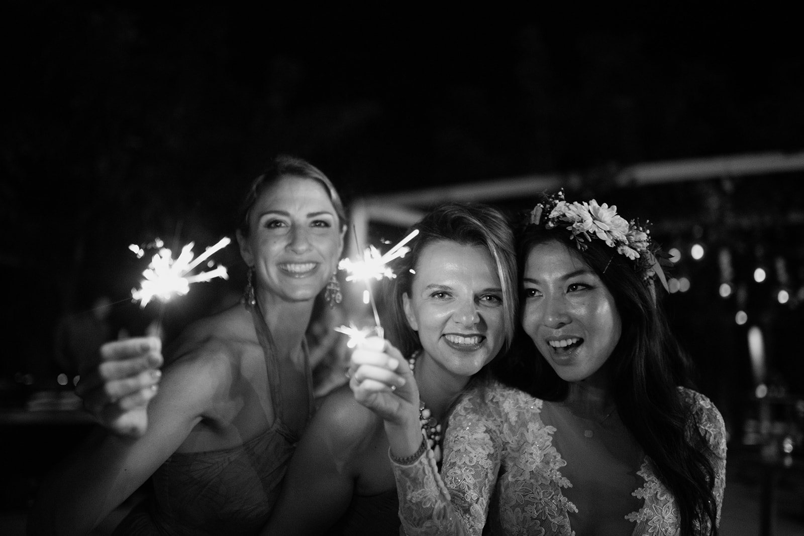 Friends with sparklers, in black and white