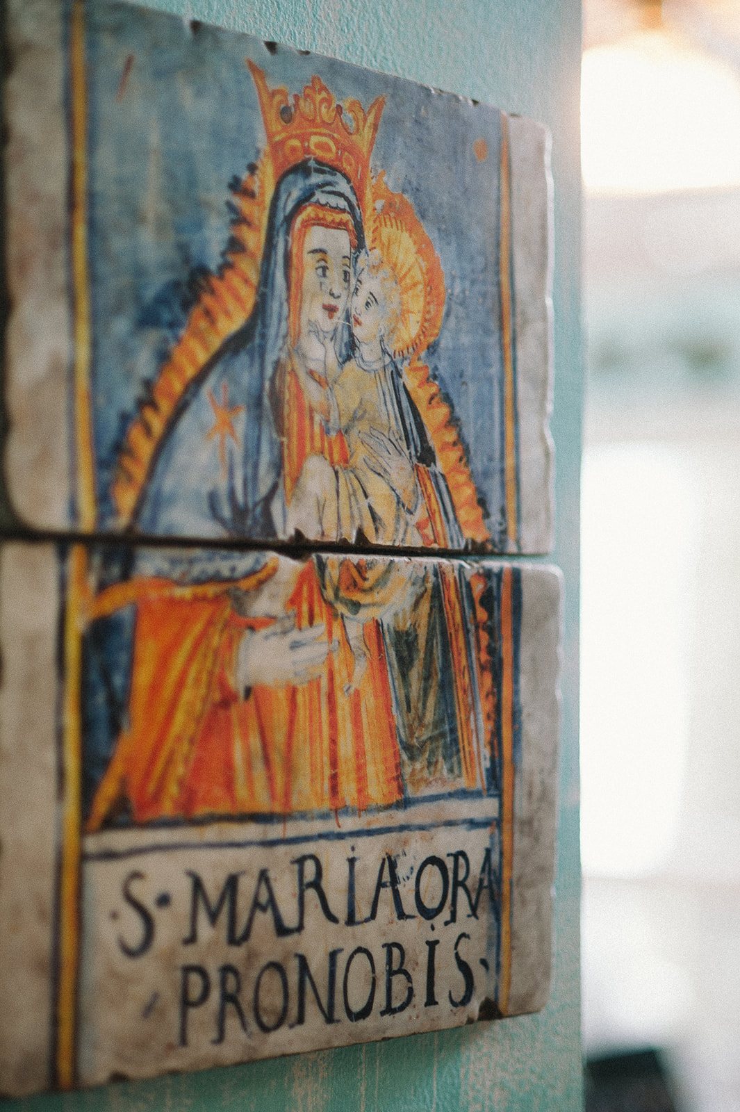 A painted saint on a tile