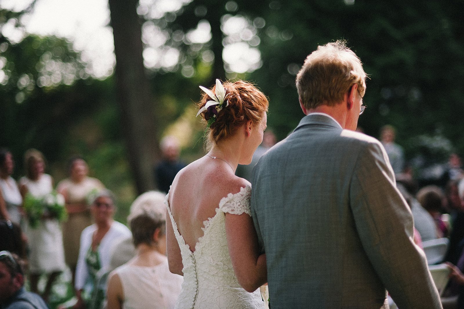 The bride walking down the aisle with her father