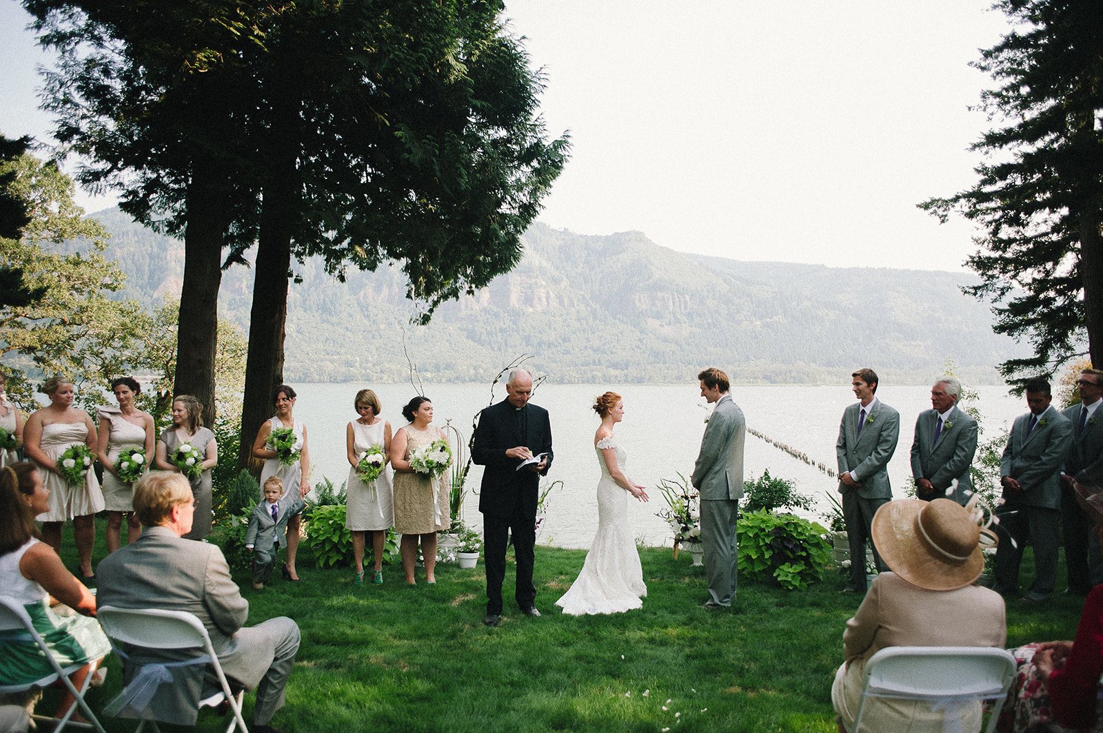 A ceremony on a lawn above the Columbia River