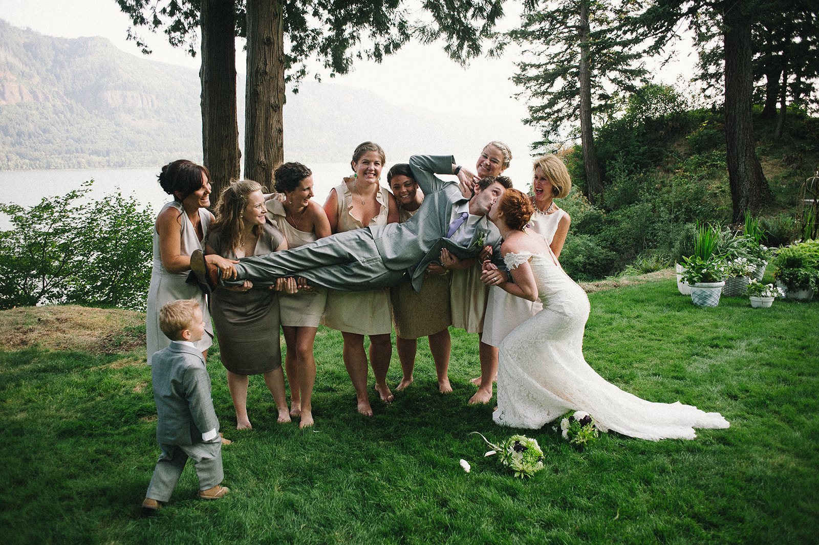 Friends piling in for a hug on the lawn