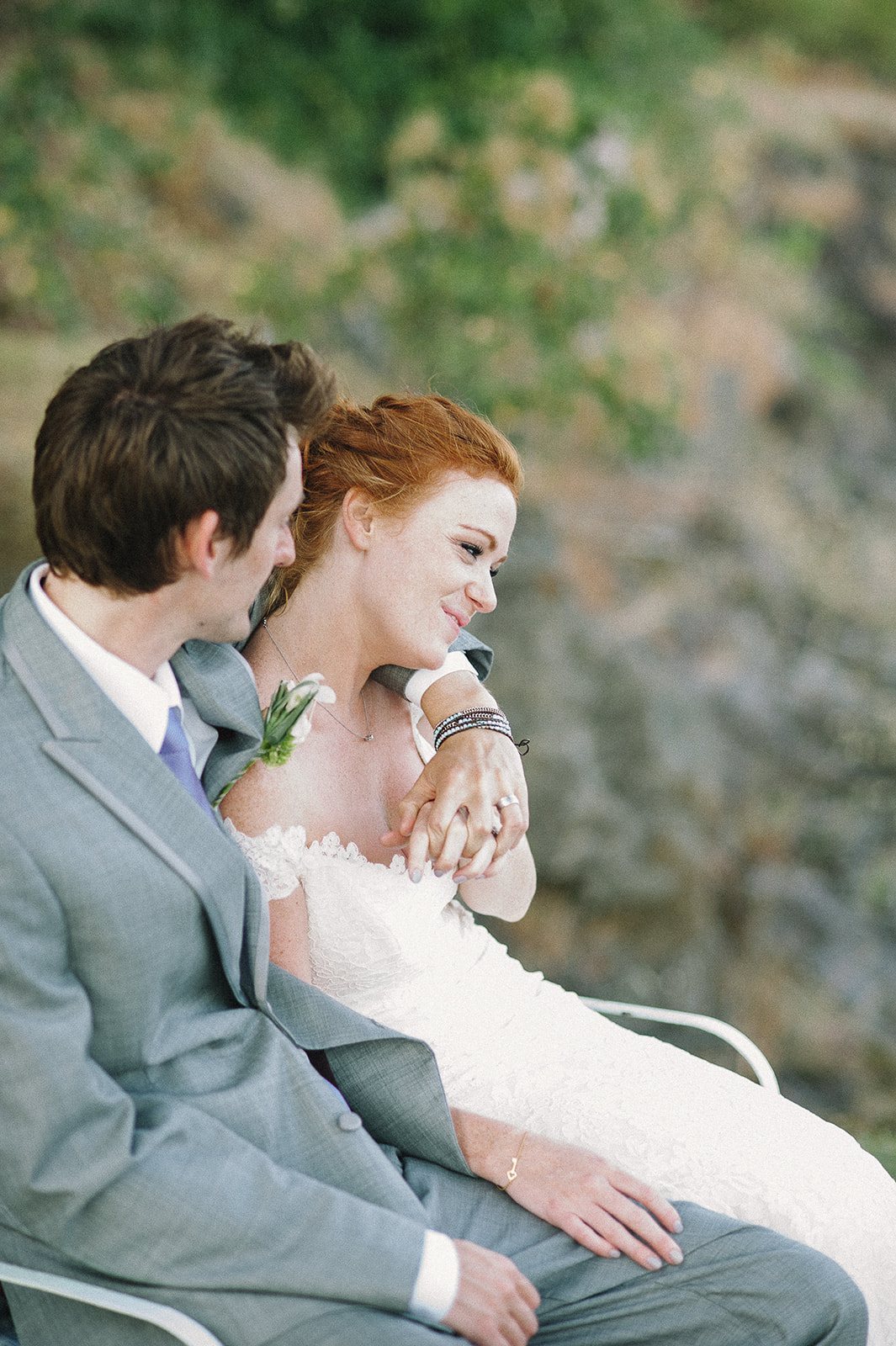 A couple close together on a deck above the Columbia River Gorge