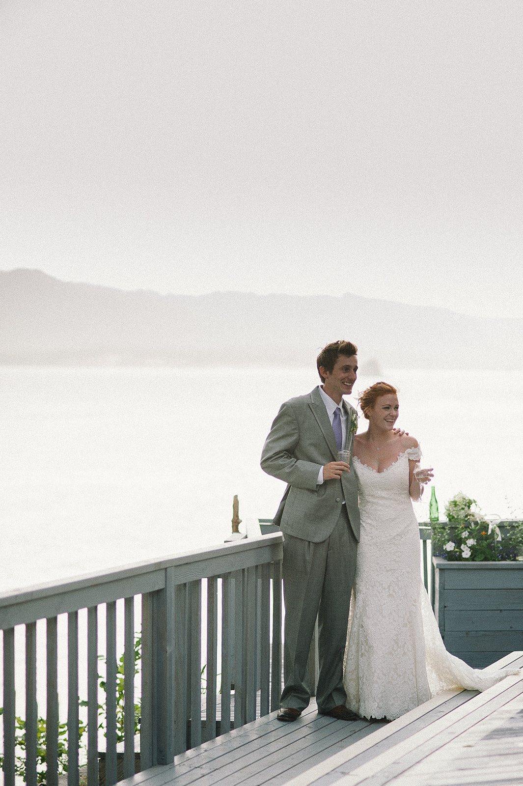 The couple on the balcony above the river