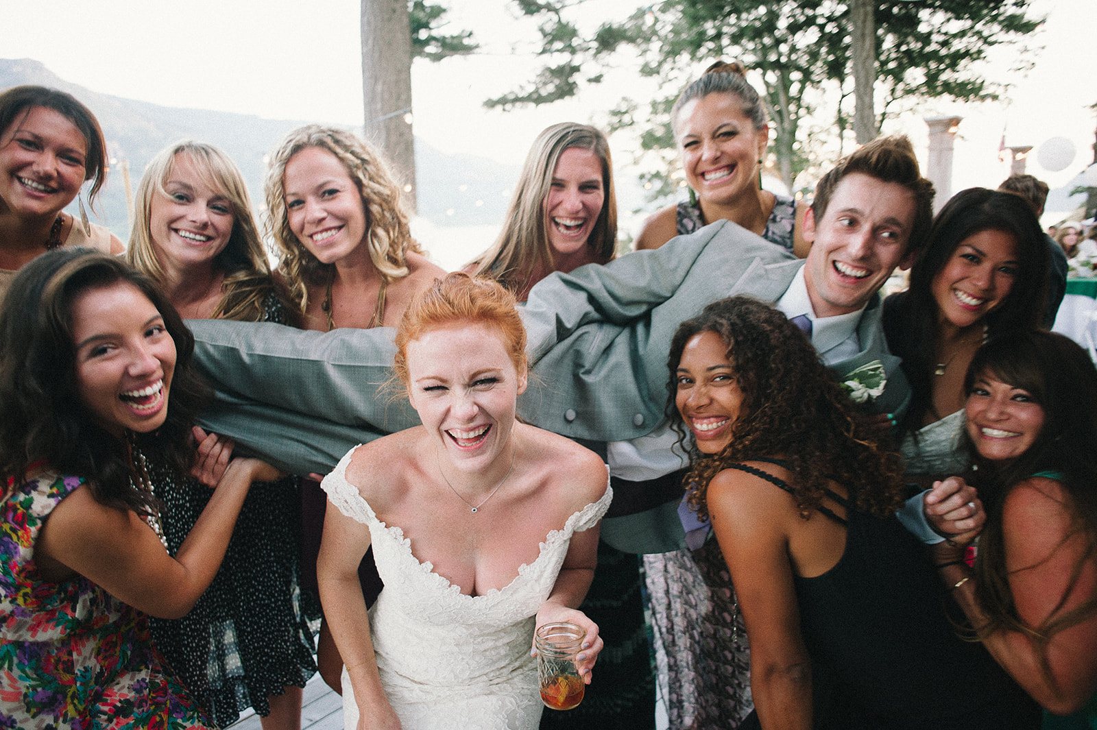 The bride with friends crowding in