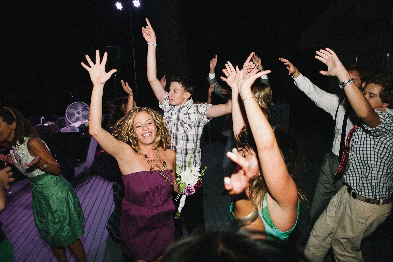 Guests dancing with their arms up
