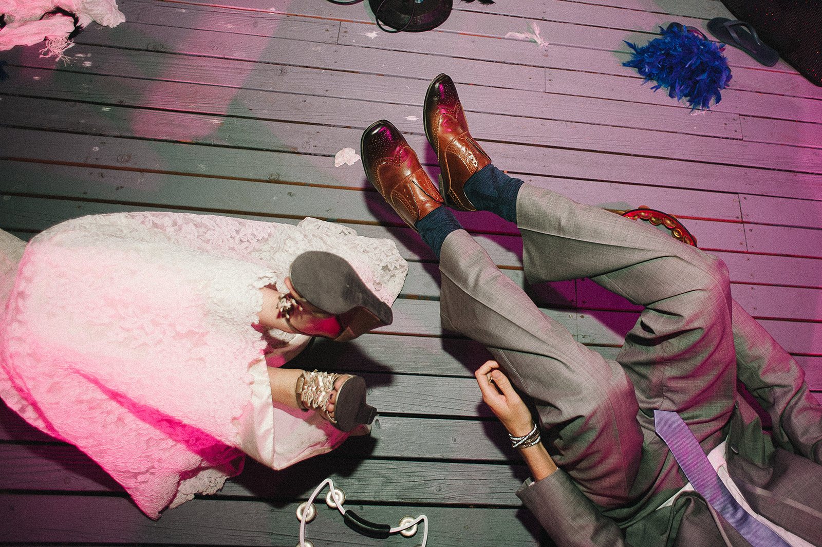 Shoes kicked up on the deck in a pink blur